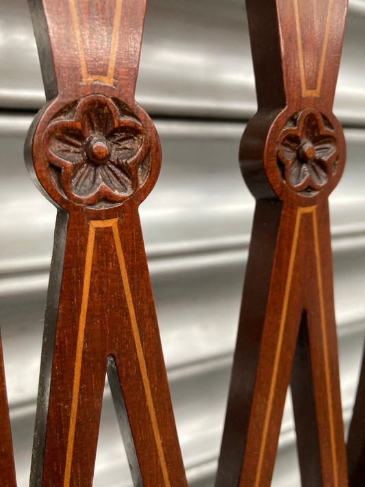 Single antique dining chair with floral seat and gold inlaid trim on back rest