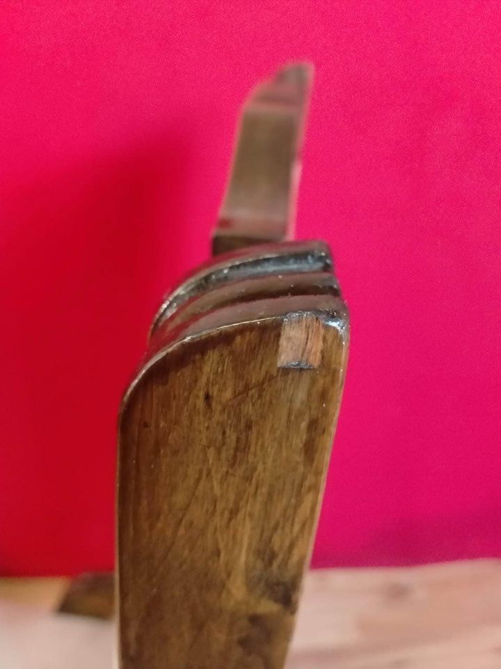 Carved oak antique upholstered nursing chair on castors