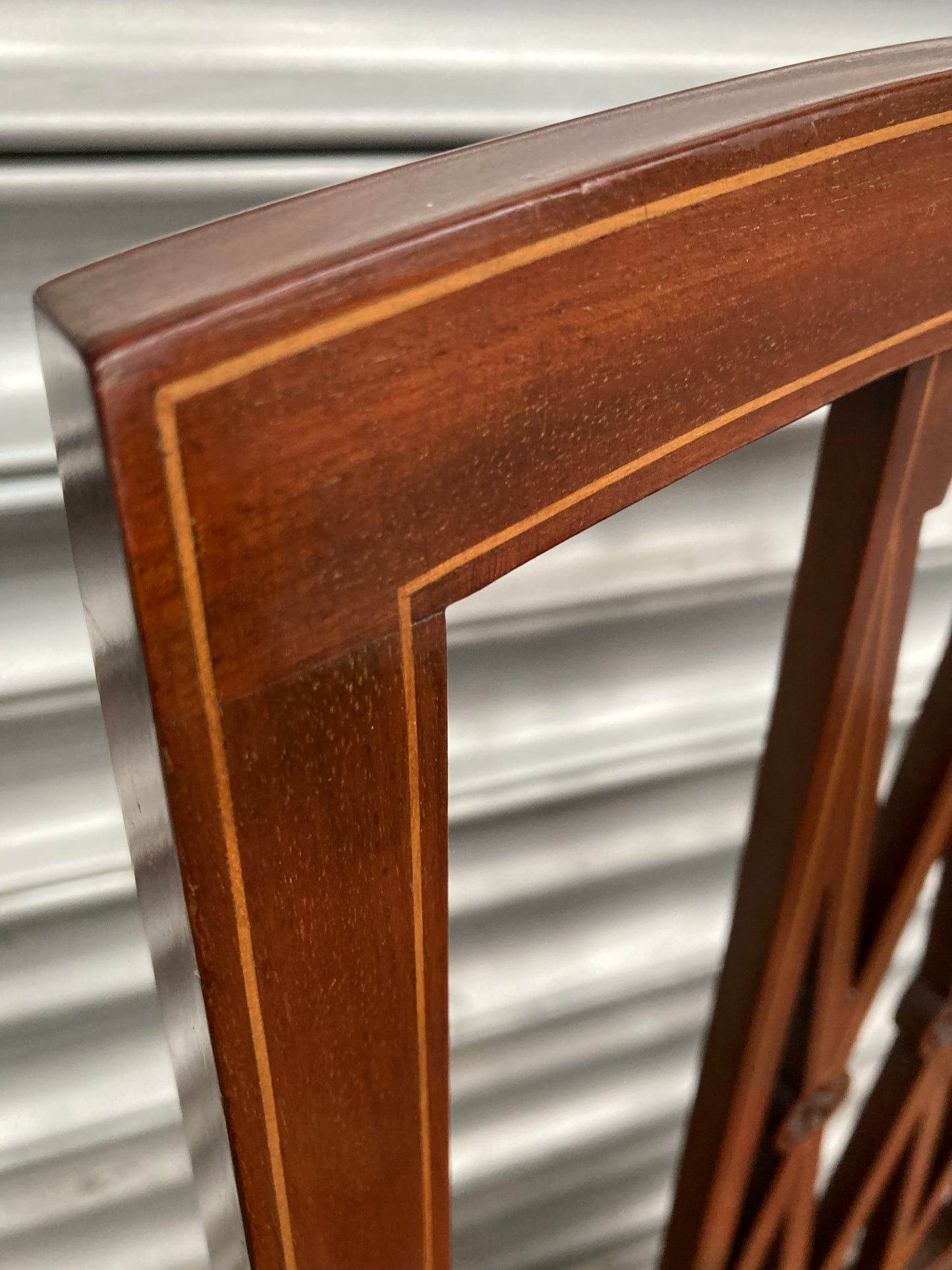 Single antique dining chair with floral seat and gold inlaid trim on back rest